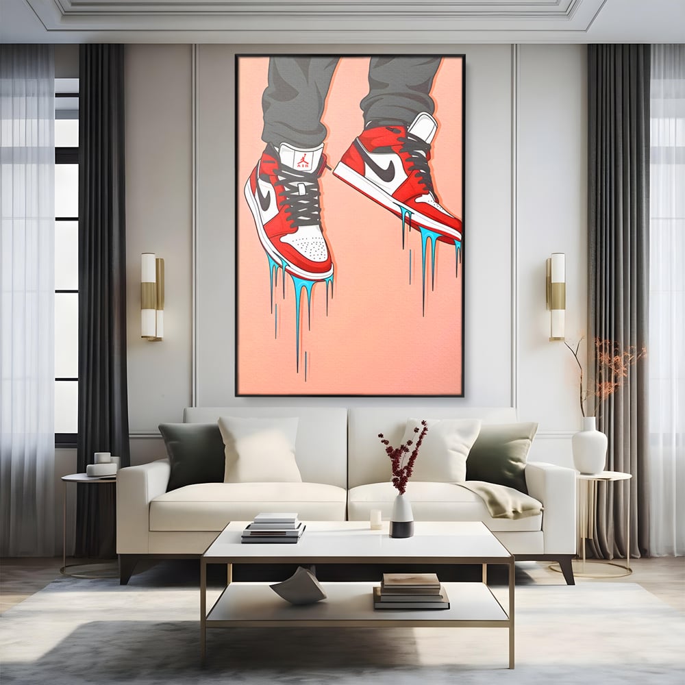 Tablou canvas cu ilustratie digitala cu adidasi rosii, in rama de aluminiu negru, pe perete intr-un living